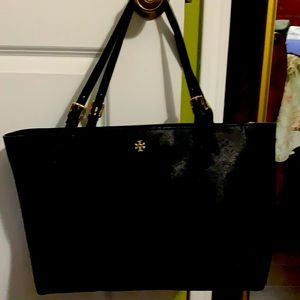 Barely used Tory Burch . Small scratch in front and in the back .
